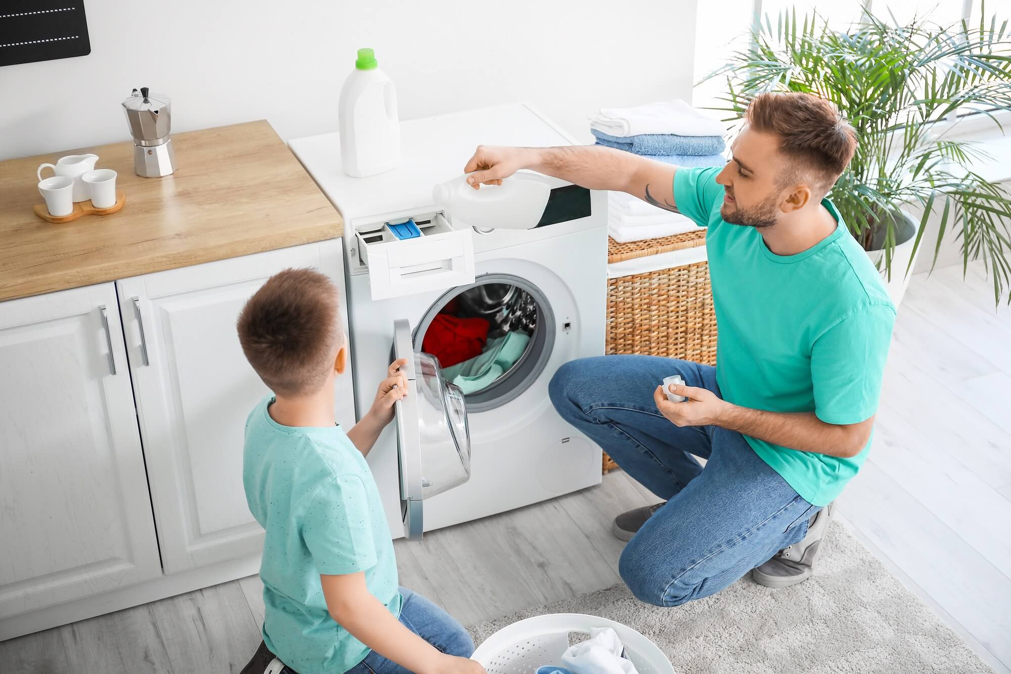 image of man & boy at washing machine